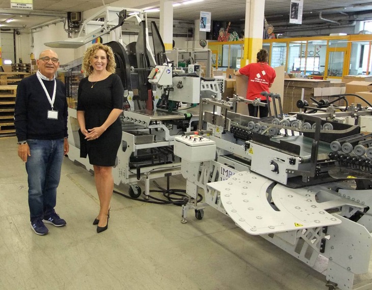 Tonino Dominici and Marie-Soleil Boutet standing in front of a VIRTUO packer from IMPACK