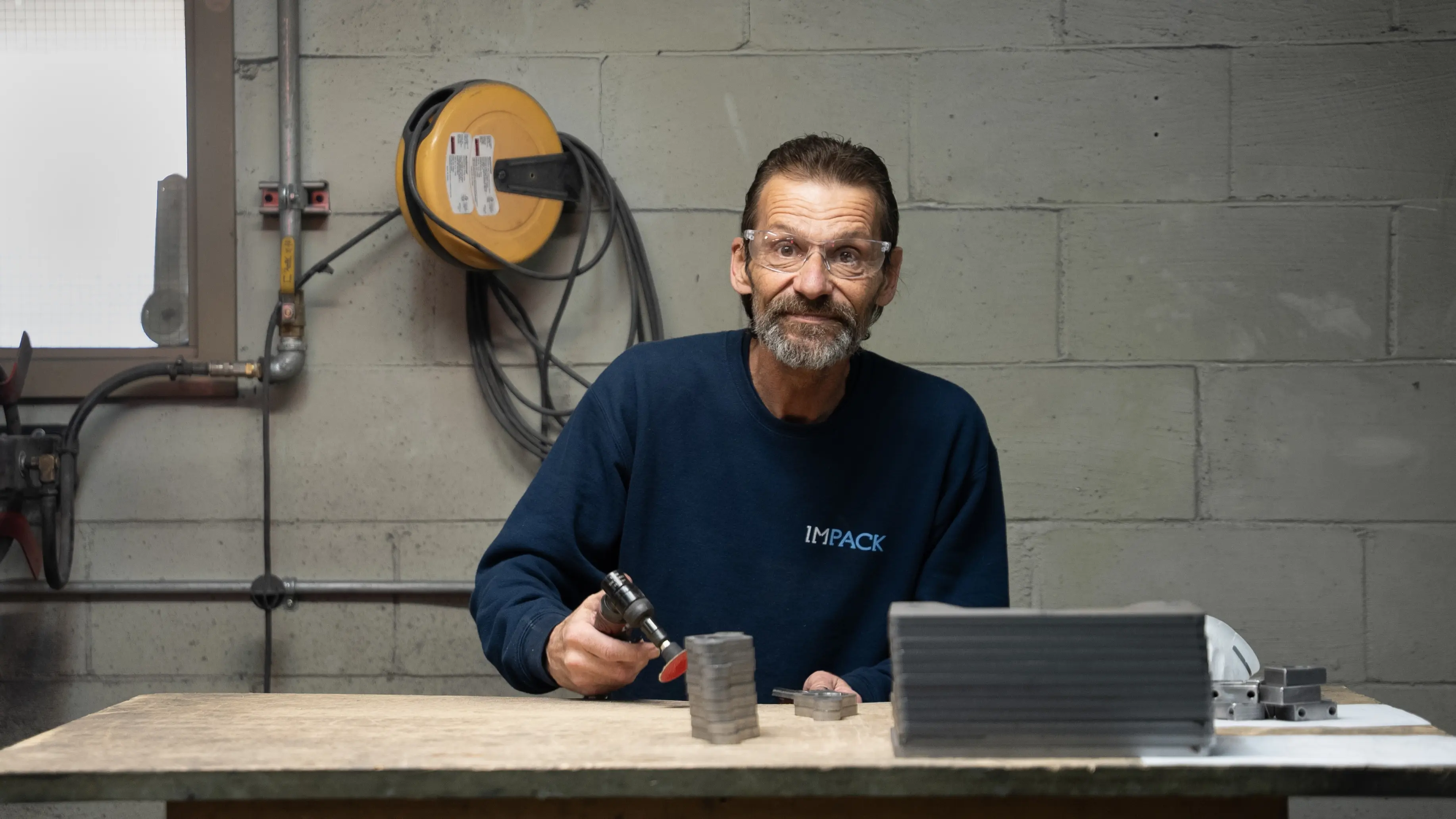 Mario smiling at his deburring station